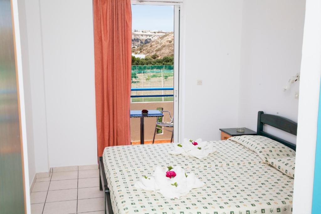 Postel nebo postele na pokoji v ubytování Hotel Athinoula