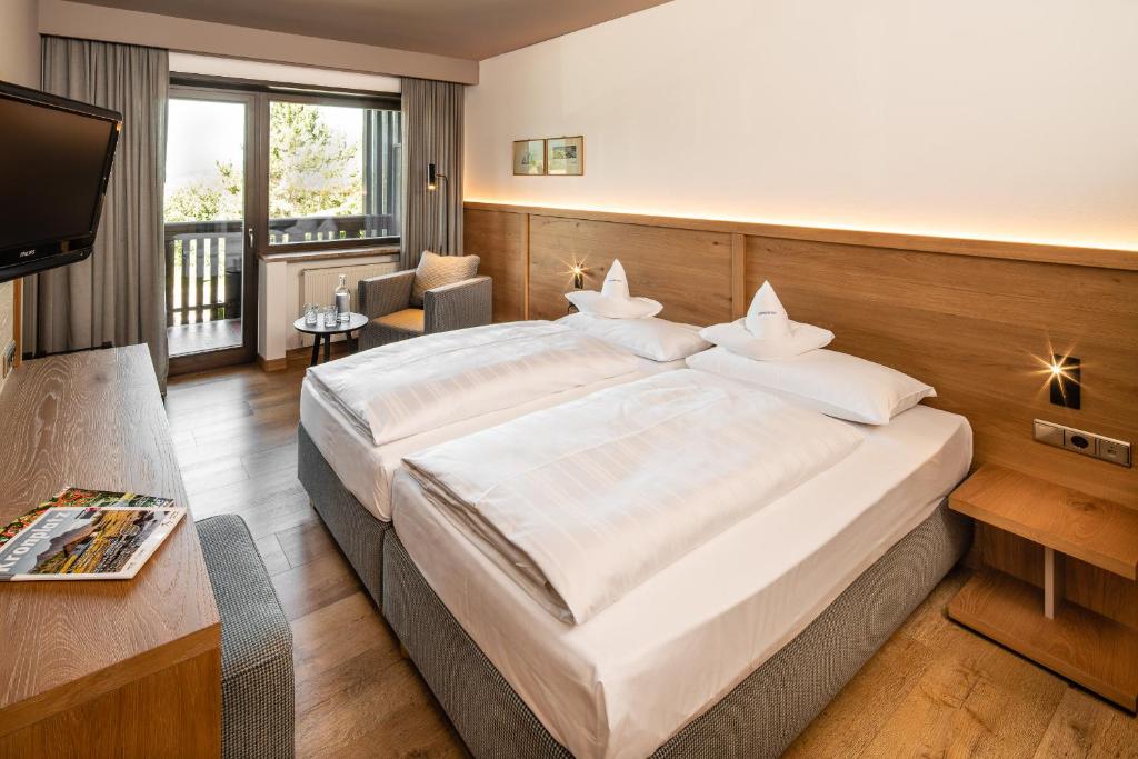 Postel nebo postele na pokoji v ubytování Royal Hotel Hinterhuber