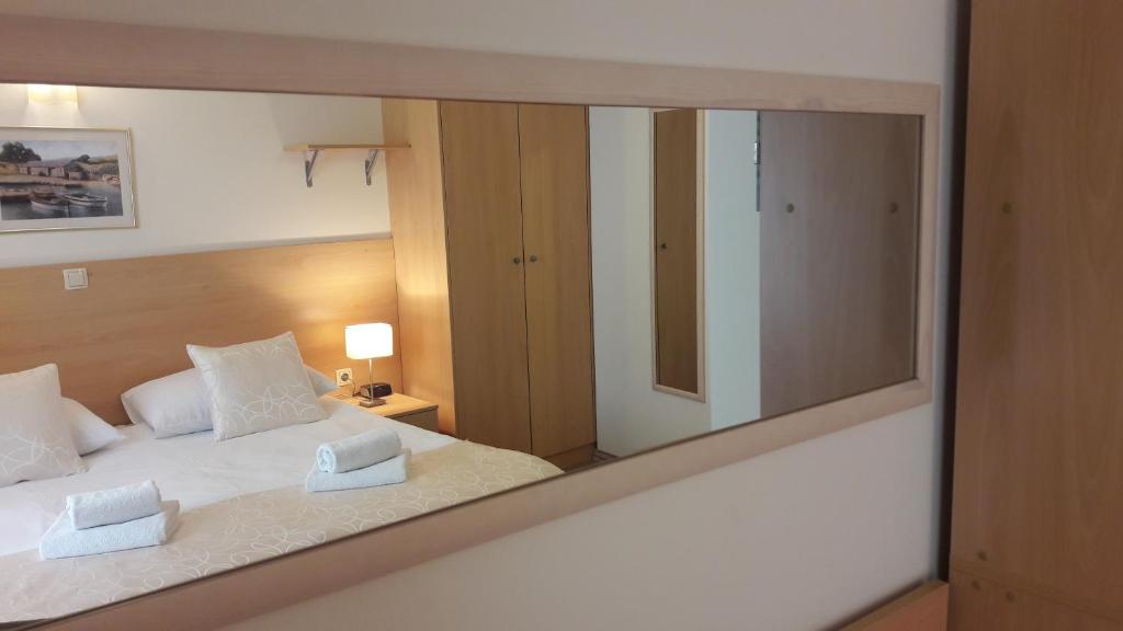 Postel nebo postele na pokoji v ubytování Old Town Suites