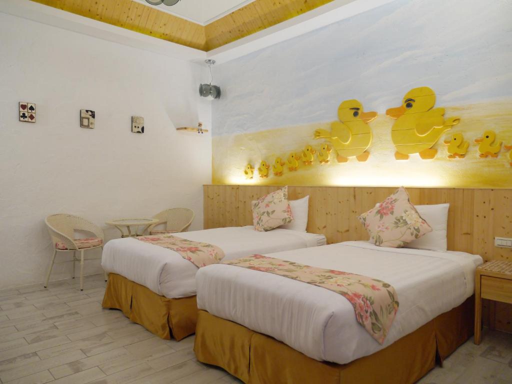 Postel nebo postele na pokoji v ubytování Kenting Sin Sin Hotel IIl