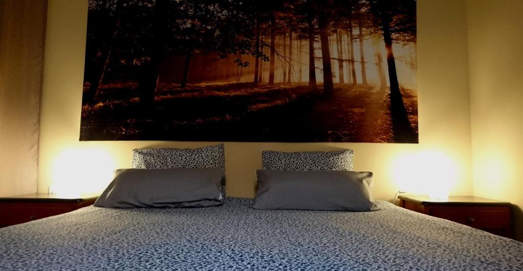 A bed or beds in a room at Frodo Haus