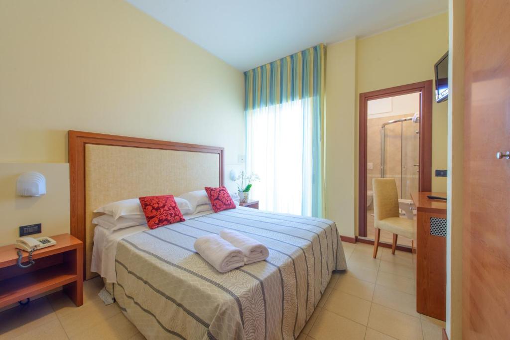 Postel nebo postele na pokoji v ubytování Hotel Zeus