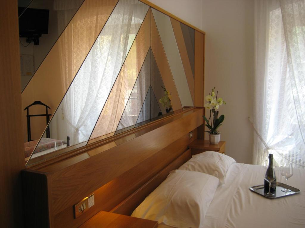 Postel nebo postele na pokoji v ubytování Albergo Ristorante Da Neni