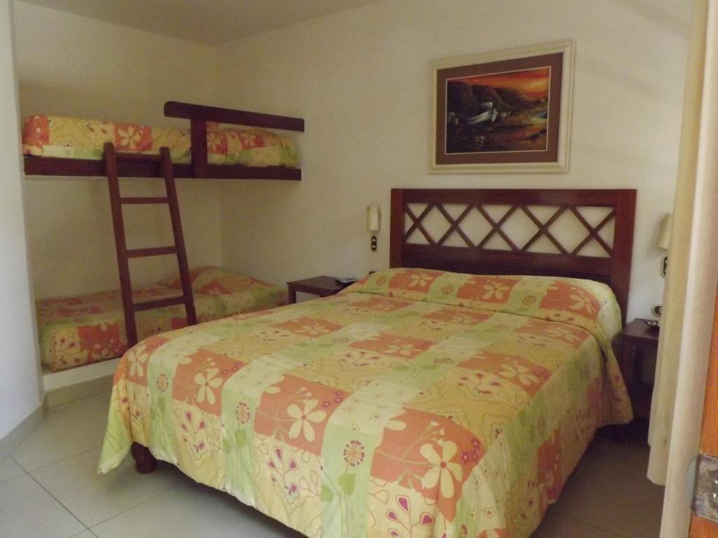 Postel nebo postele na pokoji v ubytování Bungalows Playa Bonita