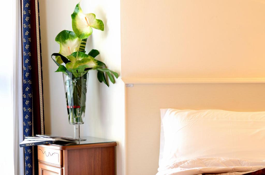 Łóżko lub łóżka w pokoju w obiekcie Hotel HDomus