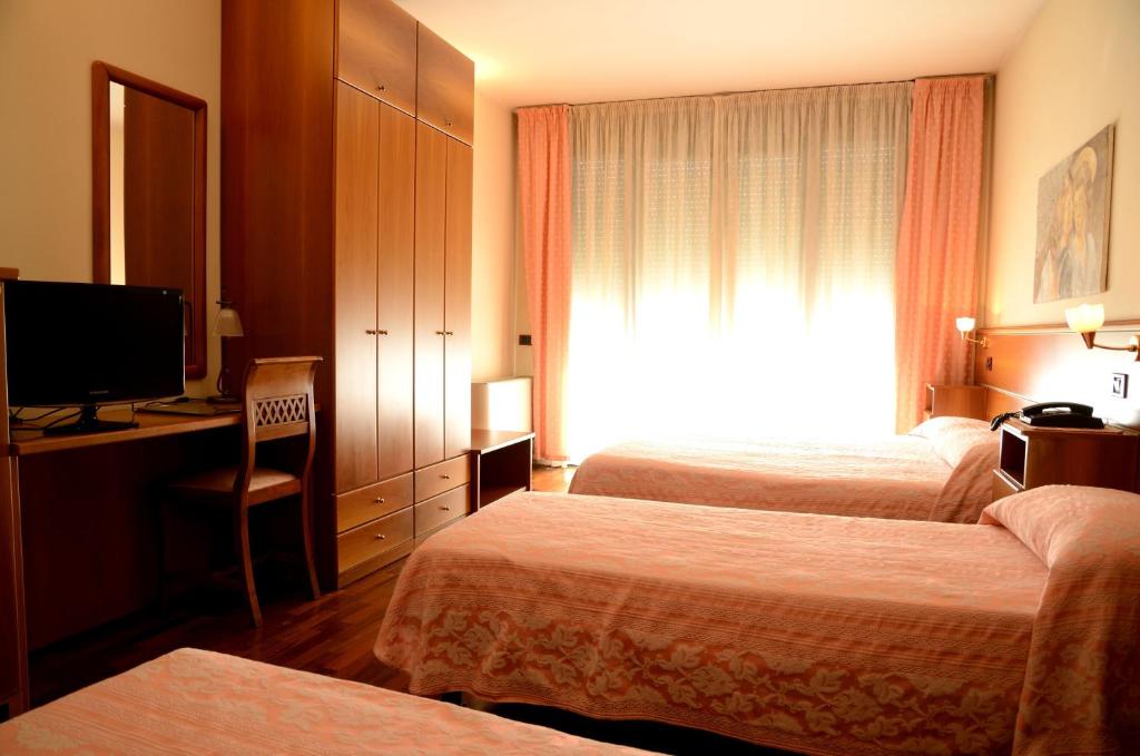 Łóżko lub łóżka w pokoju w obiekcie Hotel HDomus