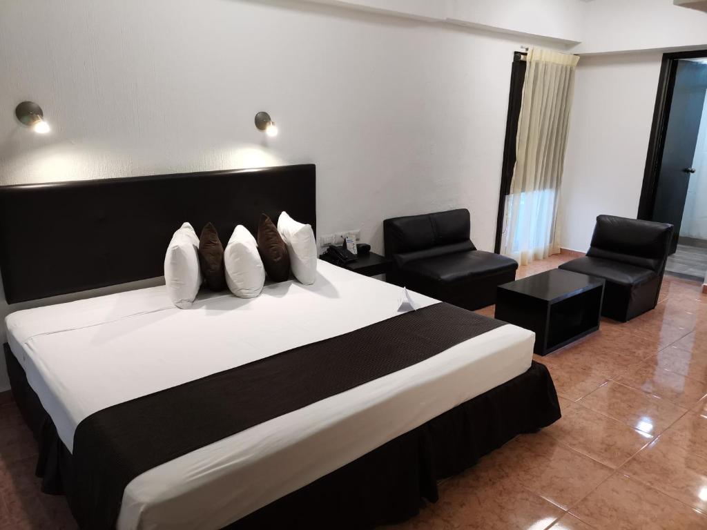 Postel nebo postele na pokoji v ubytování Hotel Maya Yucatan