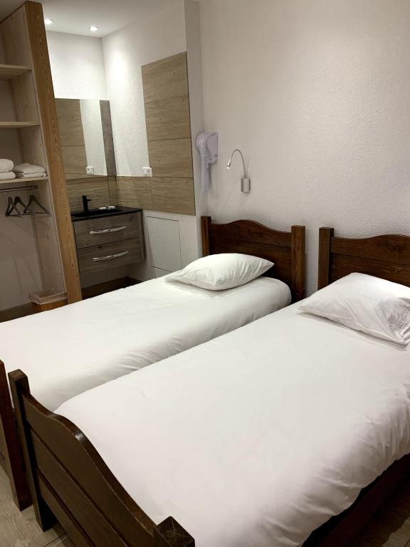 Postel nebo postele na pokoji v ubytování Espace Morteau