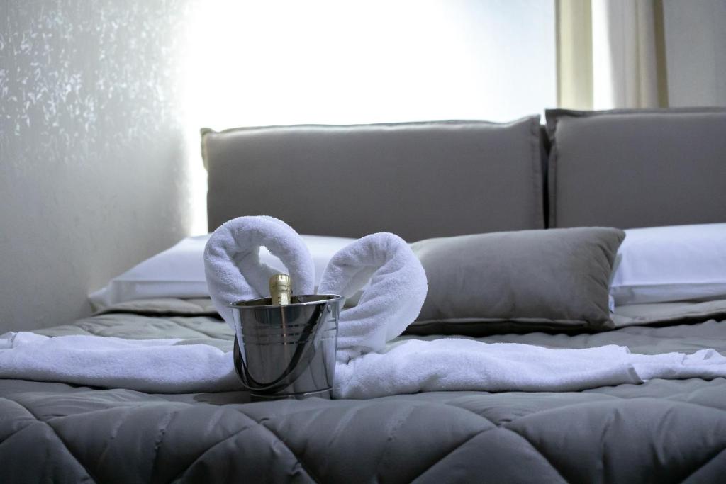 Una cama o camas en una habitación de ALBA DEL CAPO