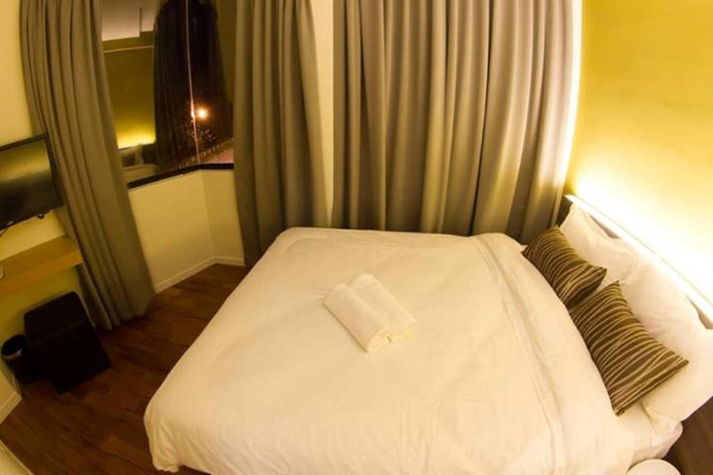 Postel nebo postele na pokoji v ubytování Mood Hotel
