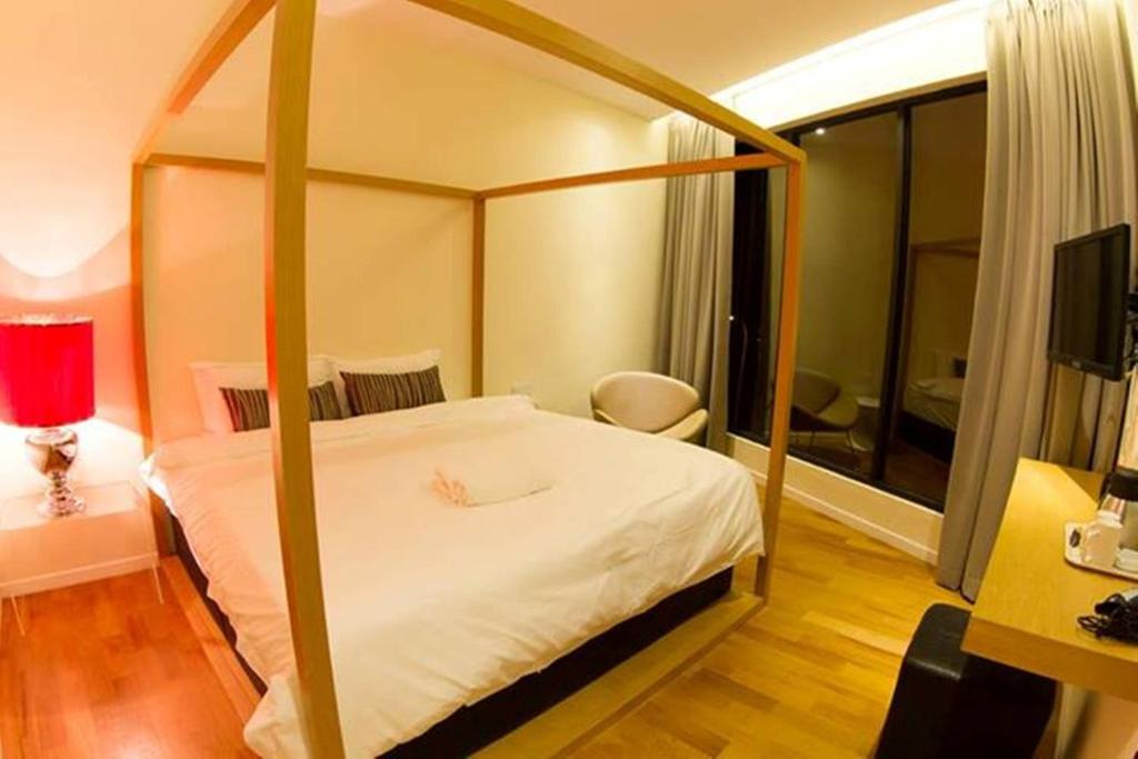 Postel nebo postele na pokoji v ubytování Mood Hotel