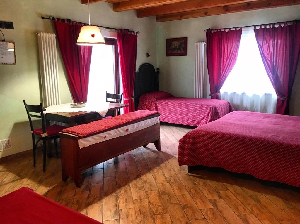Postel nebo postele na pokoji v ubytování Agriturismo B&B Chèvres à Cheval