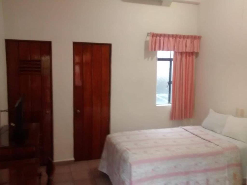 Postel nebo postele na pokoji v ubytování HOTEL POSADA DEL SOL