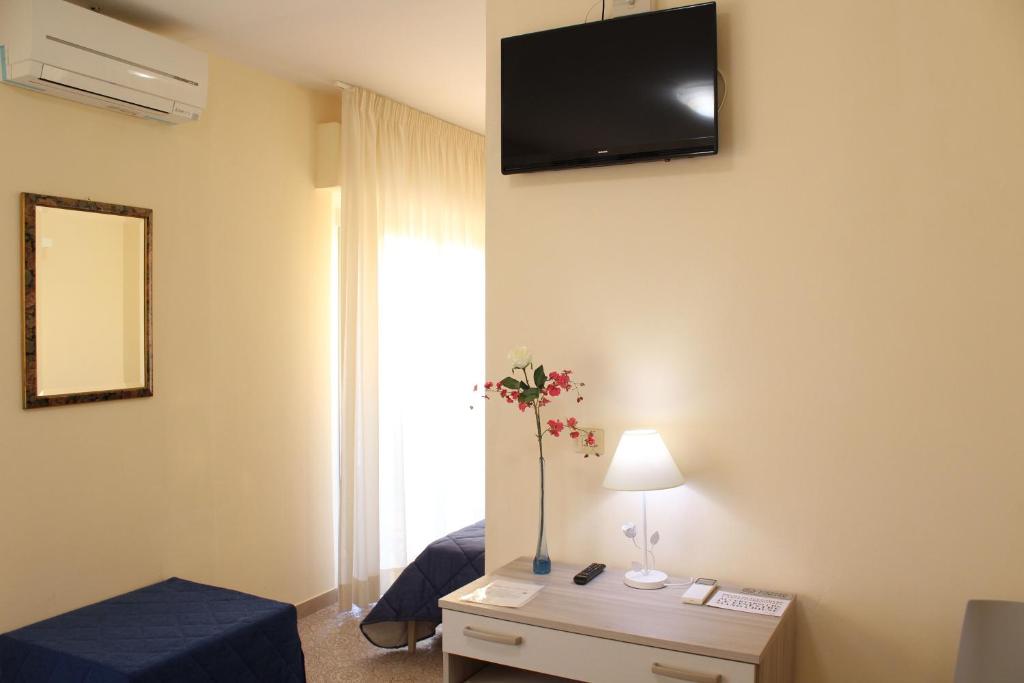 TV a/nebo společenská místnost v ubytování Hotel Luca