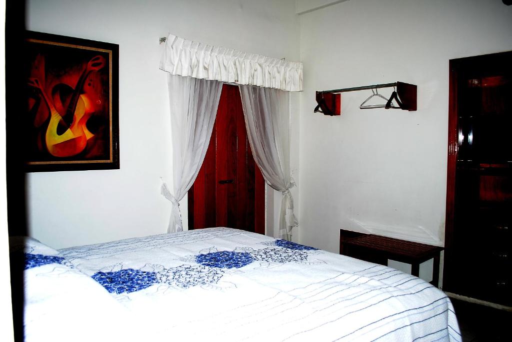Postel nebo postele na pokoji v ubytování HOTEL POSADA DEL SOL