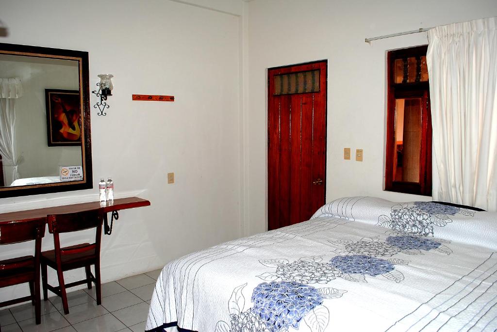 Postel nebo postele na pokoji v ubytování HOTEL POSADA DEL SOL