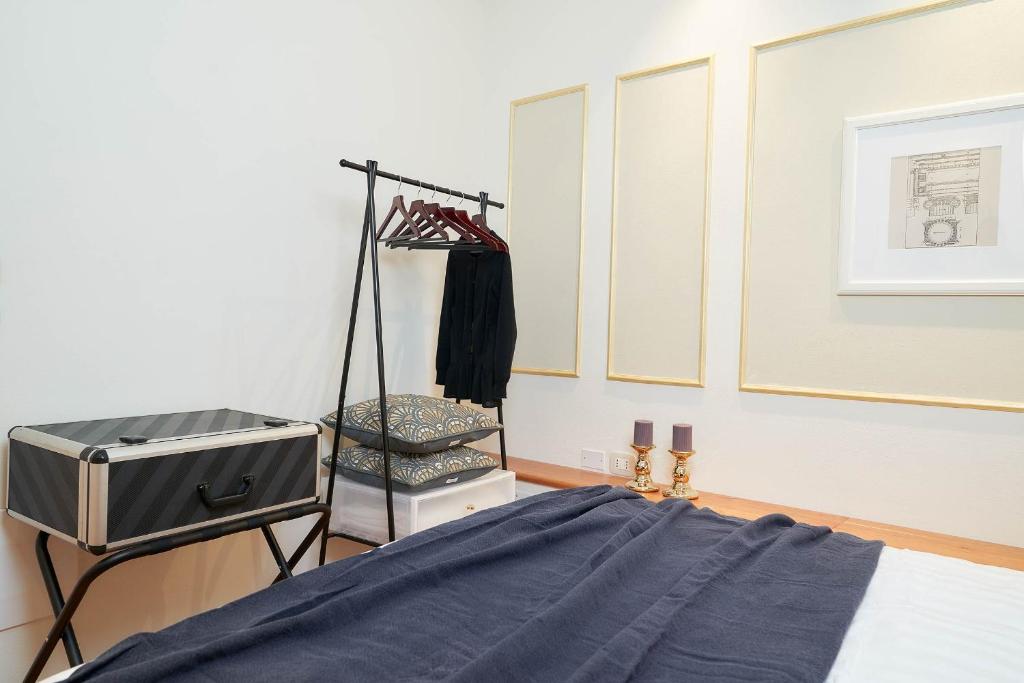 Łóżko lub łóżka w pokoju w obiekcie AppartamentoPalladio140
