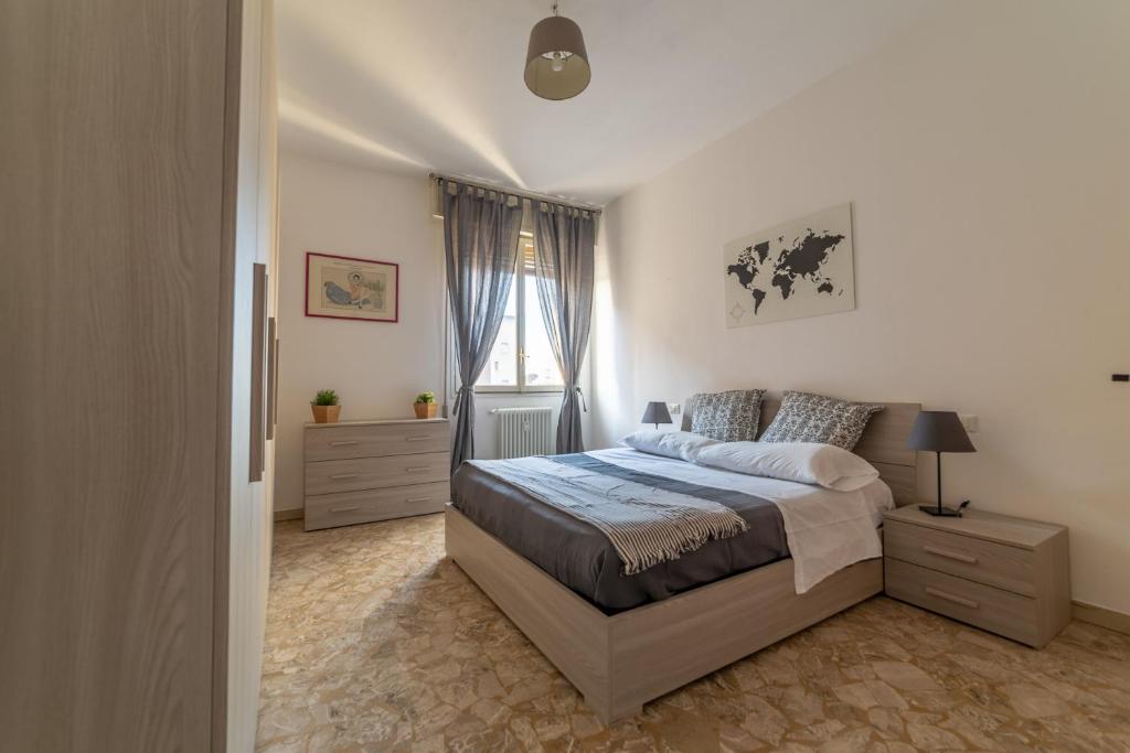a bedroom with a bed and a window at Bologna Fiera Fani Apartment in Bologna