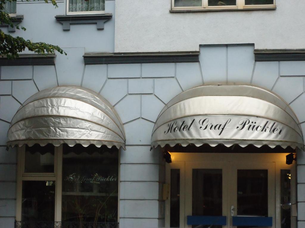 a building with two arches on the front of it at Hotel Graf Pückler in Berlin
