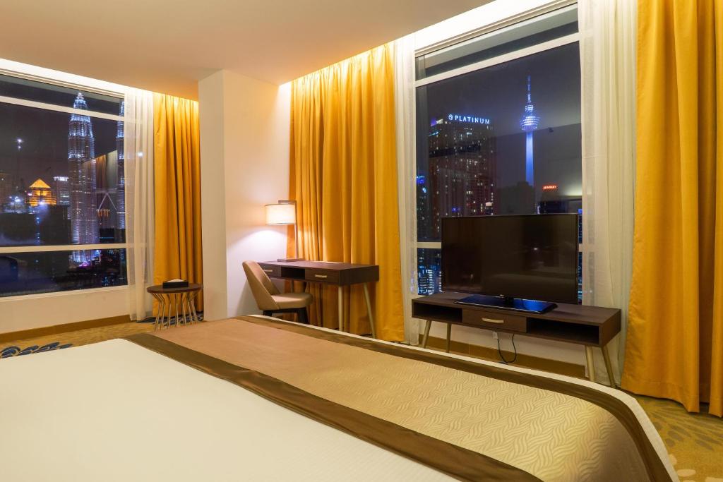 Katil atau katil-katil dalam bilik di Tamu Hotel & Suites Kuala Lumpur