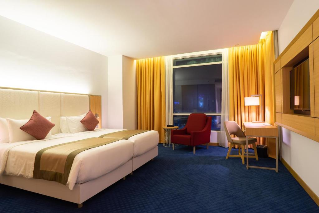 Katil atau katil-katil dalam bilik di Tamu Hotel & Suites Kuala Lumpur