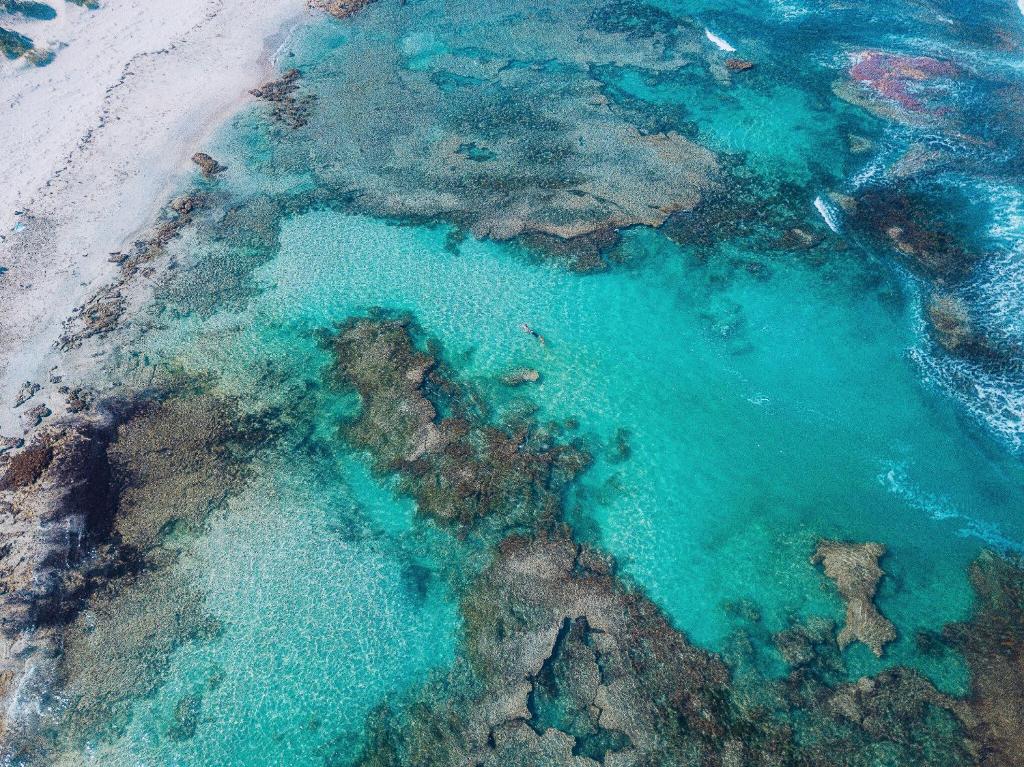 an aerial view of the ocean near a beach at 27 Degrees Kalbarri in Kalbarri