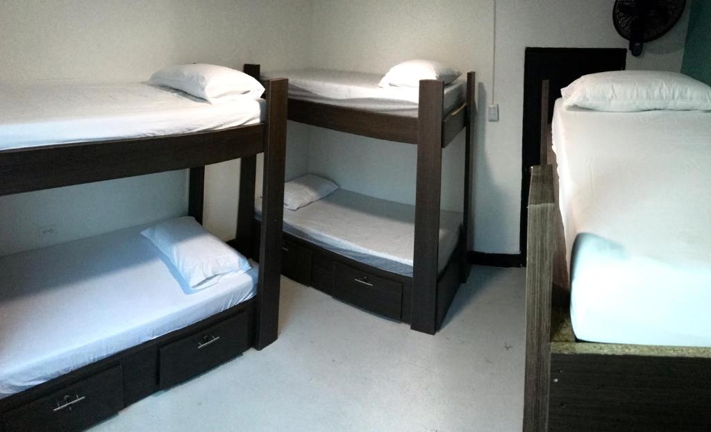 Postel nebo postele na pokoji v ubytování La Quinta Bacana