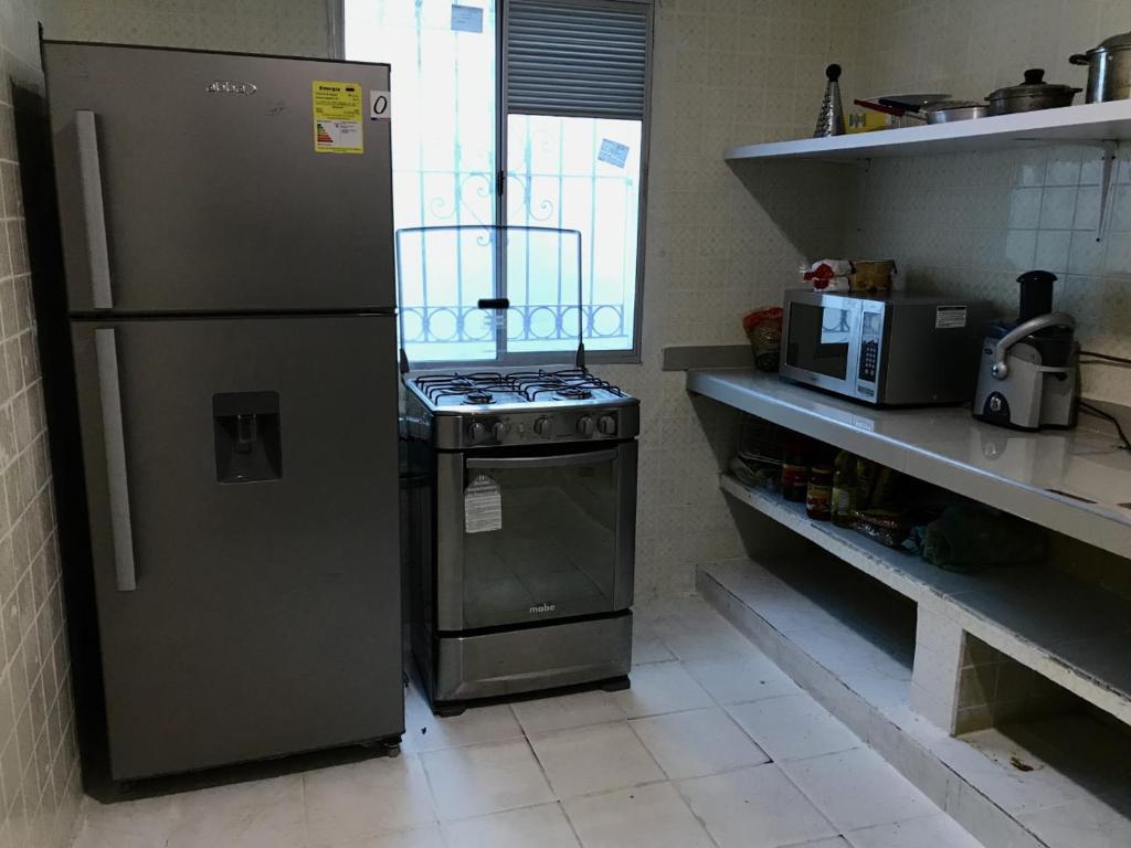 Kuchyň nebo kuchyňský kout v ubytování La Quinta Bacana