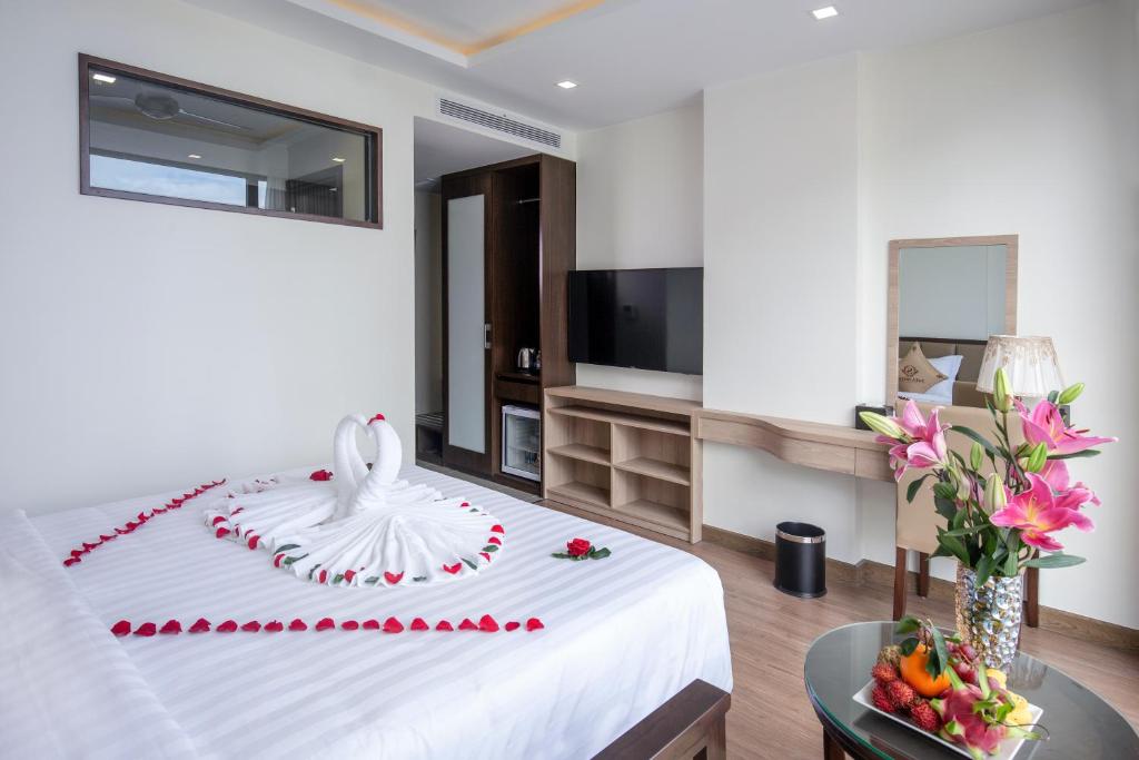 Postel nebo postele na pokoji v ubytování Sata Hotel
