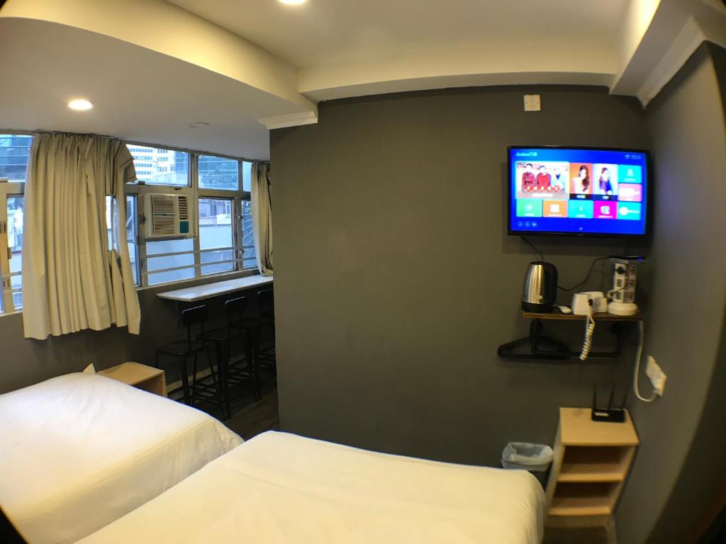 Ένα ή περισσότερα κρεβάτια σε δωμάτιο στο Soso Hostel