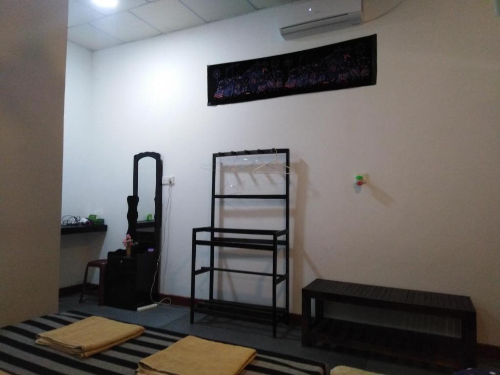 Postel nebo postele na pokoji v ubytování Asiri HomeStay