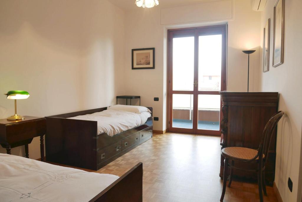 Posteľ alebo postele v izbe v ubytovaní CaseOspitali - Casa Alberata, trilocale nel verde a pochi minuti dal San Raffaele
