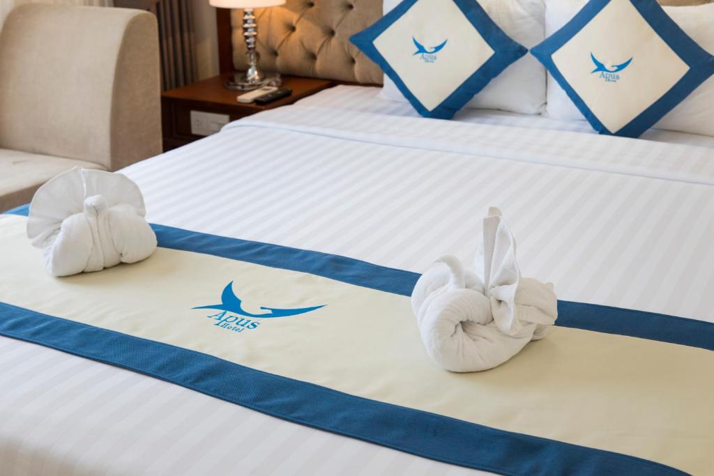 Giường trong phòng chung tại Apus Hotel