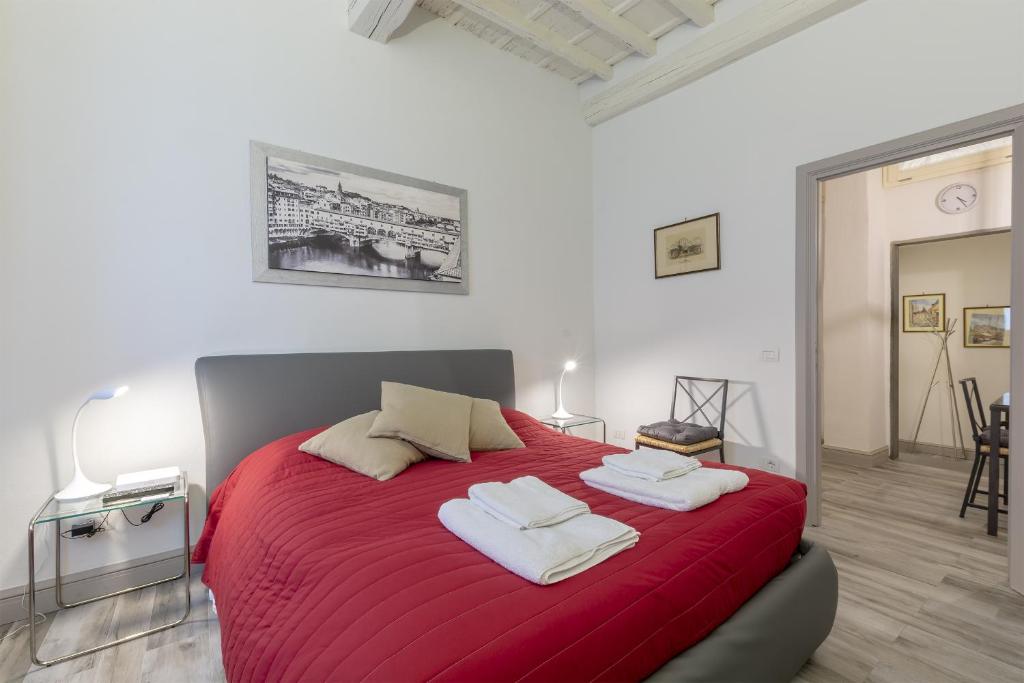 Posteľ alebo postele v izbe v ubytovaní Ponte Vecchio's Nest