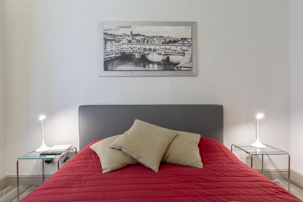 Posteľ alebo postele v izbe v ubytovaní Ponte Vecchio's Nest