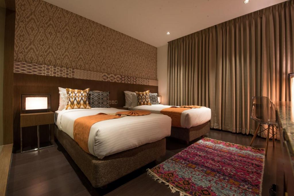 Postel nebo postele na pokoji v ubytování Hotel Gallery 67
