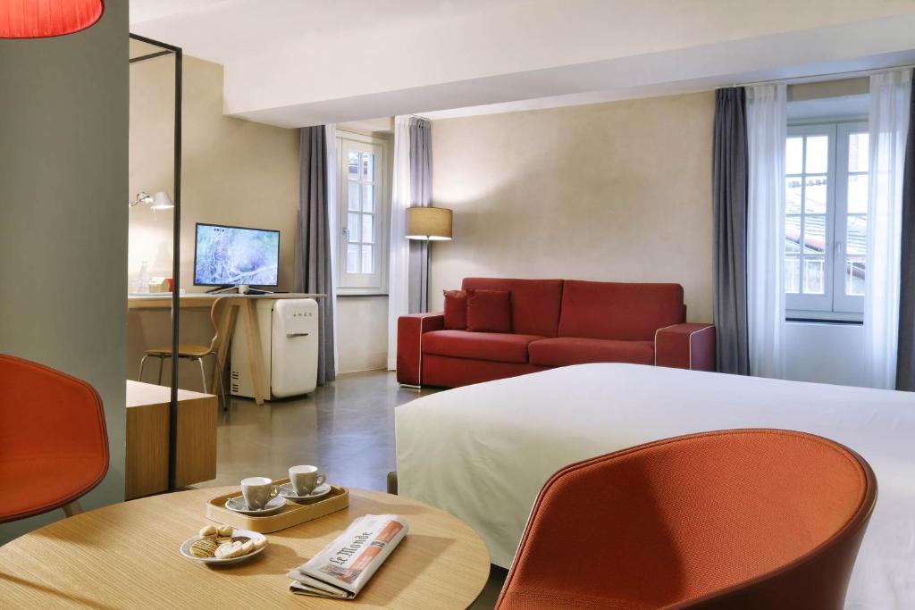 Łóżko lub łóżka w pokoju w obiekcie Hotel Palazzo Grillo