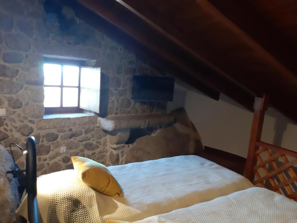 Postel nebo postele na pokoji v ubytování Taverna Lusitana