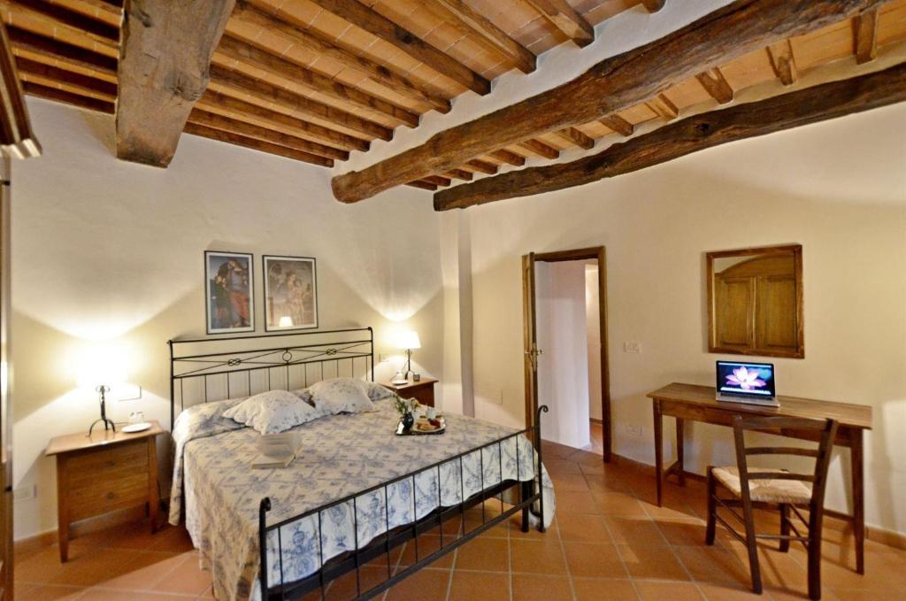 Ένα ή περισσότερα κρεβάτια σε δωμάτιο στο Pinturicchio