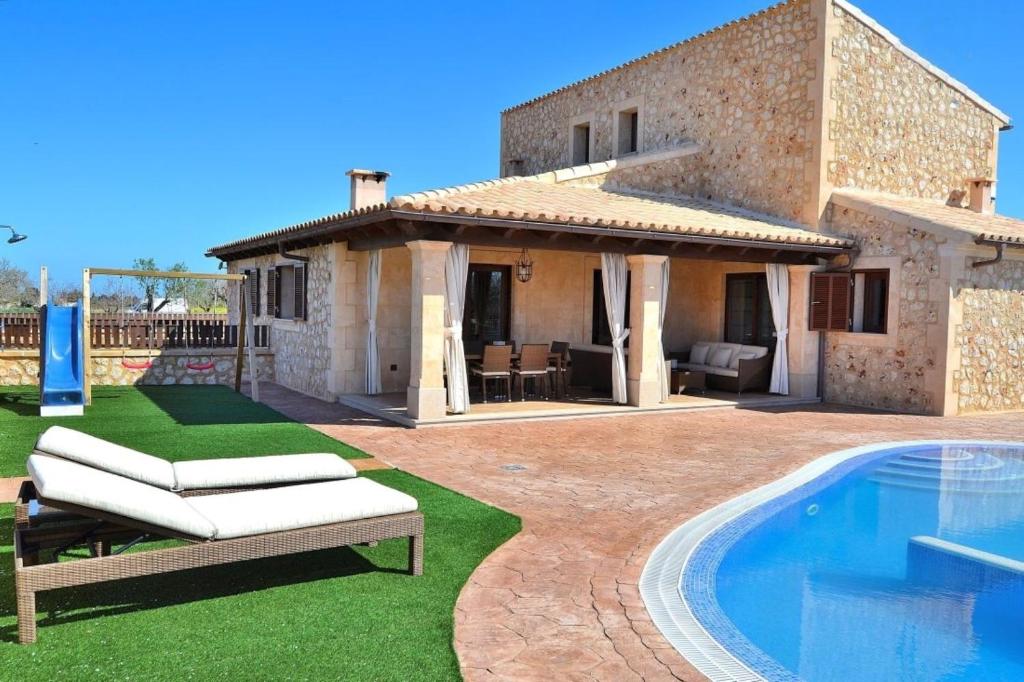 a villa with a swimming pool and a house at 065 Finca Son Costa ETV4943 by Mallorca Charme in Búger