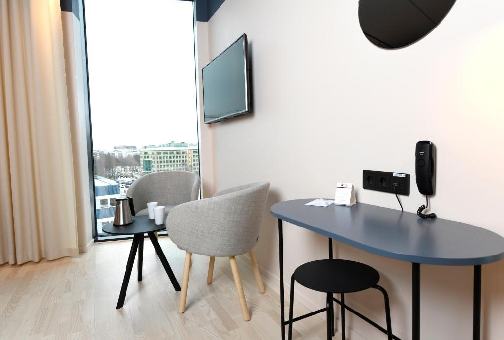 TV a/nebo společenská místnost v ubytování Best Western Plus Grow Hotel
