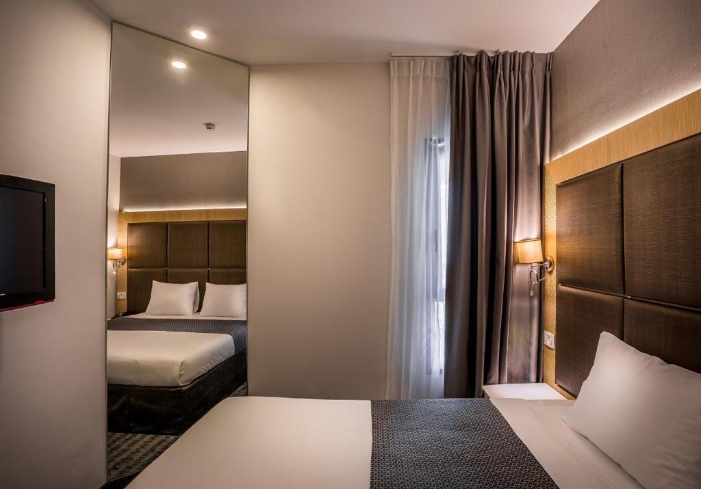 Ein Bett oder Betten in einem Zimmer der Unterkunft Hotel Astral Nirvana Club- Half Board
