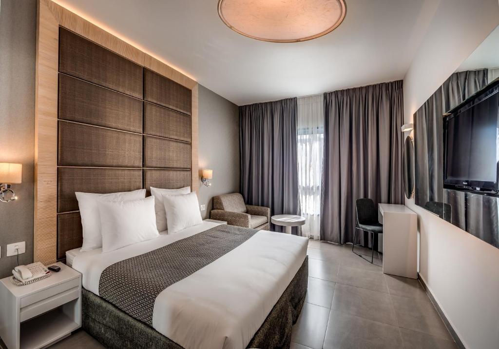 Ein Bett oder Betten in einem Zimmer der Unterkunft Hotel Astral Nirvana Club- Half Board