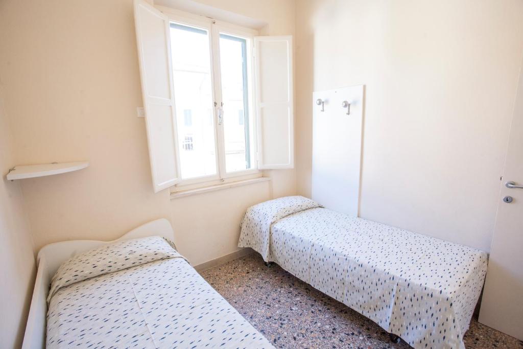 Postel nebo postele na pokoji v ubytování Appartamento in Via del Mare a Procchio