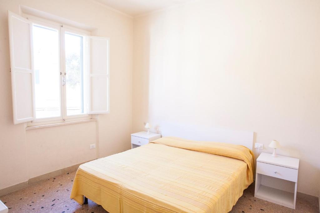 Postel nebo postele na pokoji v ubytování Appartamento in Via del Mare a Procchio