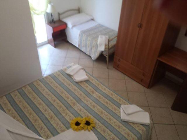 Postel nebo postele na pokoji v ubytování Hotel Penny