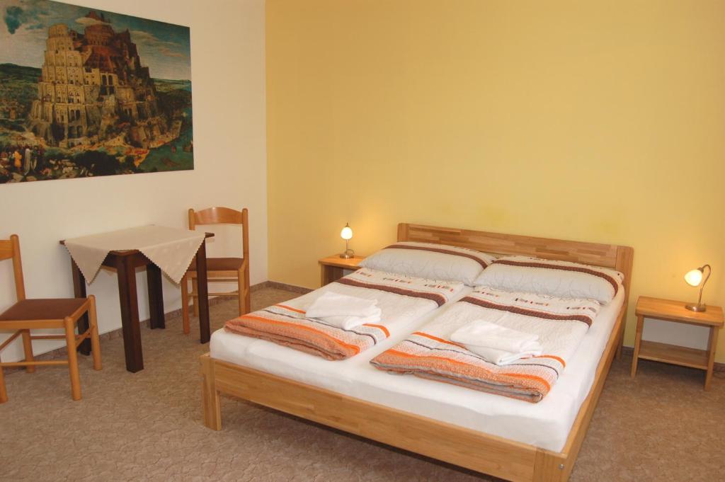 Postel nebo postele na pokoji v ubytování Apartmány Florian