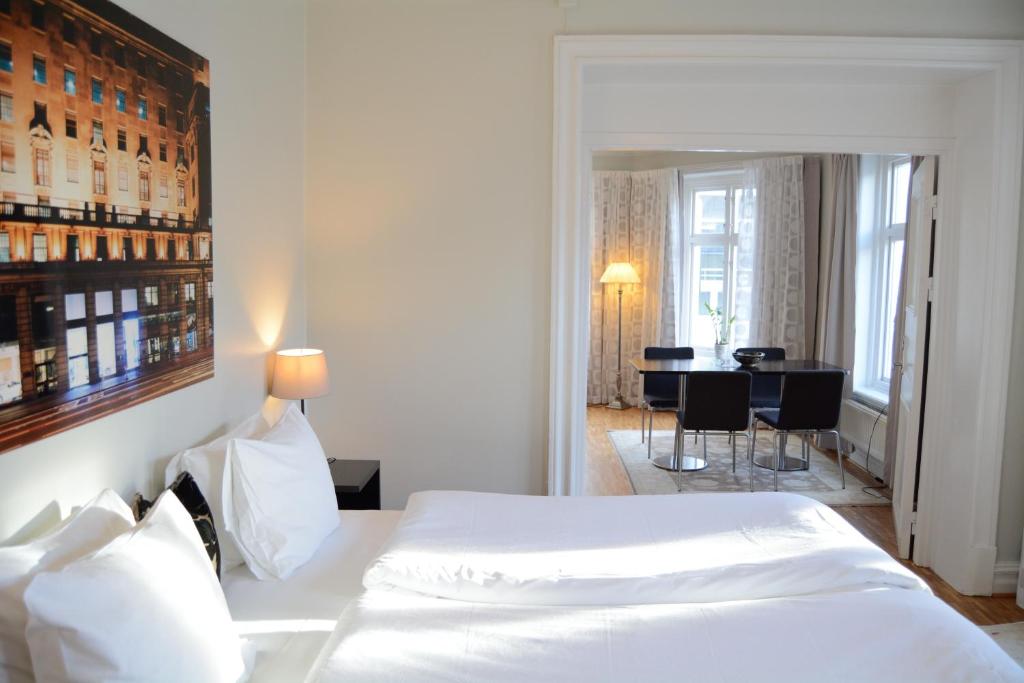 Postel nebo postele na pokoji v ubytování DA Hotel Apartments