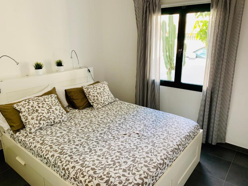 Postel nebo postele na pokoji v ubytování Apartamentos Zalabar