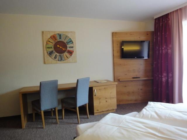 Postel nebo postele na pokoji v ubytování Hotel Alpenblick